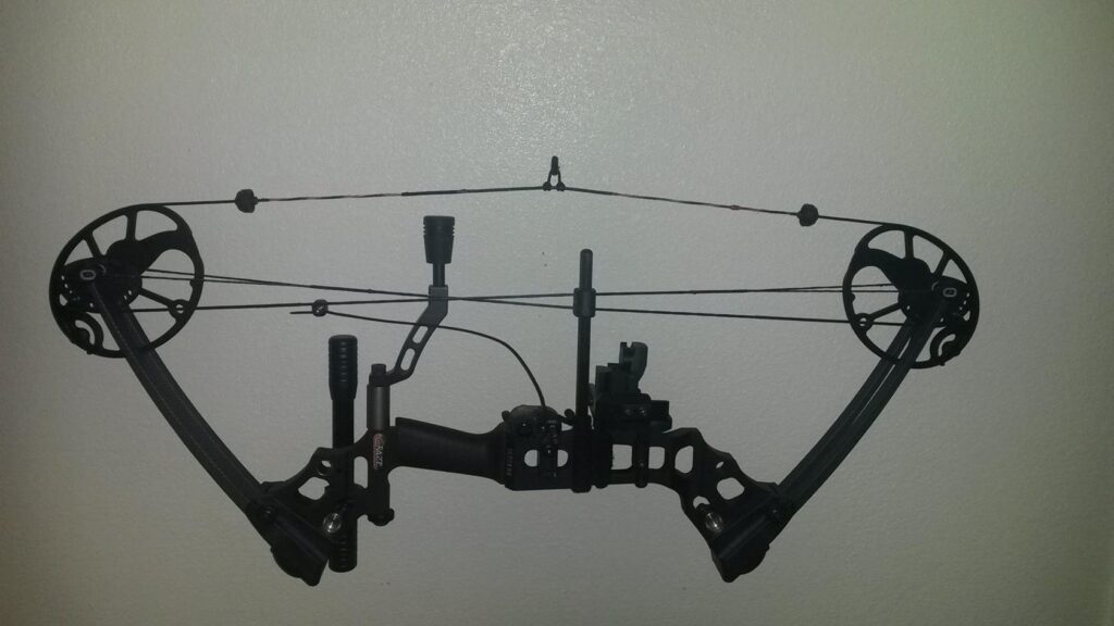 compound bow hanging with strings